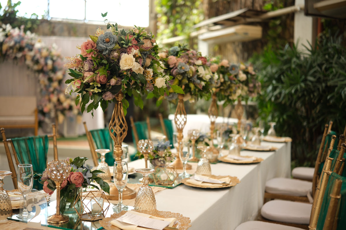 elegant wedding table centerpiece with dusty blue, dusty rose and cream centerpieces