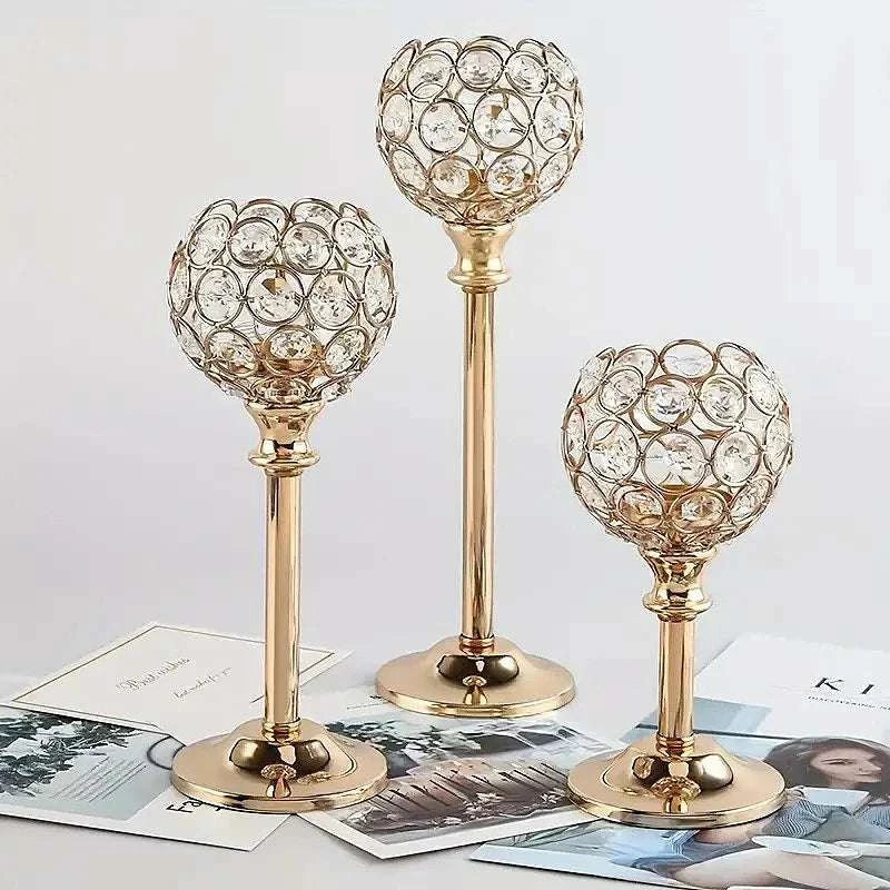Set of three golden candle holders with crystal-adorned tops, elegant tea light candlesticks for home or event decor