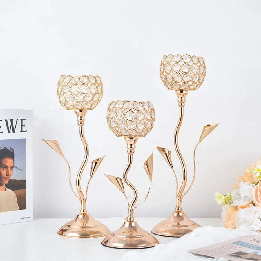 Set of three gold crystal candle holders with iron flower-shaped stems for vintage table centerpieces