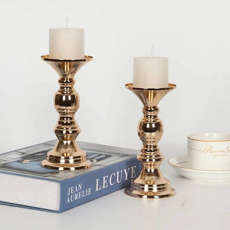 Golden candle holders metal stand candlesticks with white candles on table decor for weddings and parties