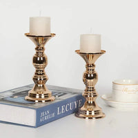Golden candle holders metal stand candlesticks with white candles on table decor for weddings and parties